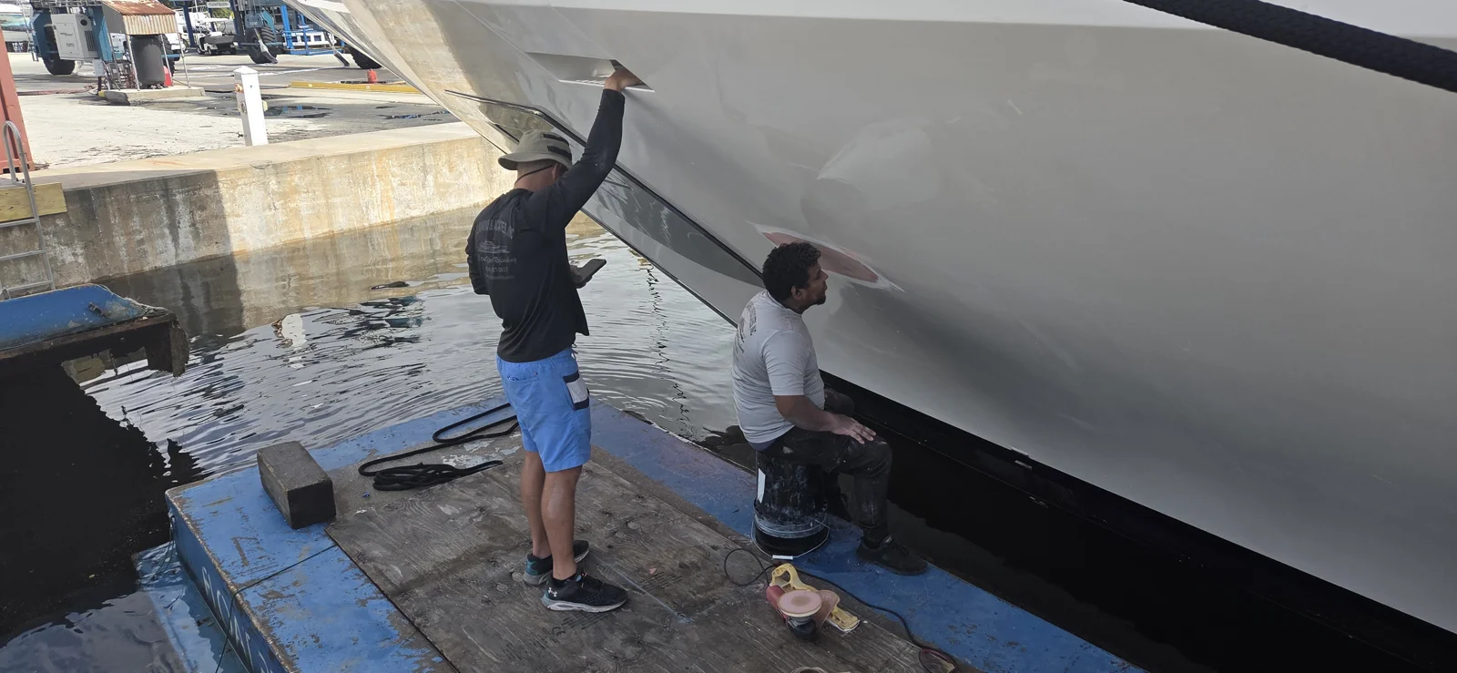 Hands-on exterior work alongside a yacht