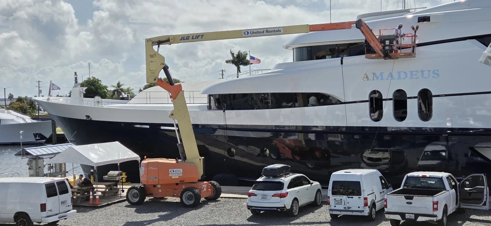 Aerial lift access along a yacht for exterior work